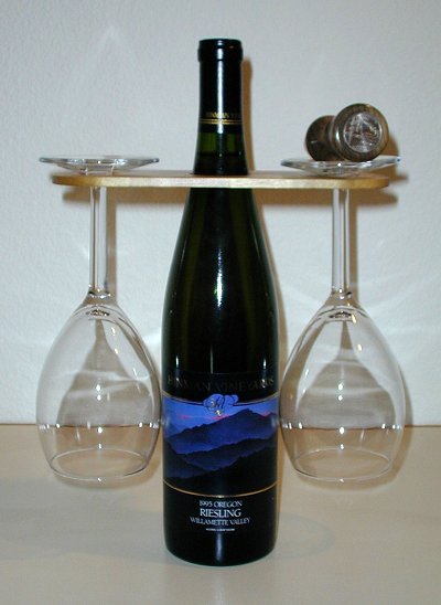 Myrtlewood Glass Holder and Bottle Stopper with an Oregon Quarter in the top.